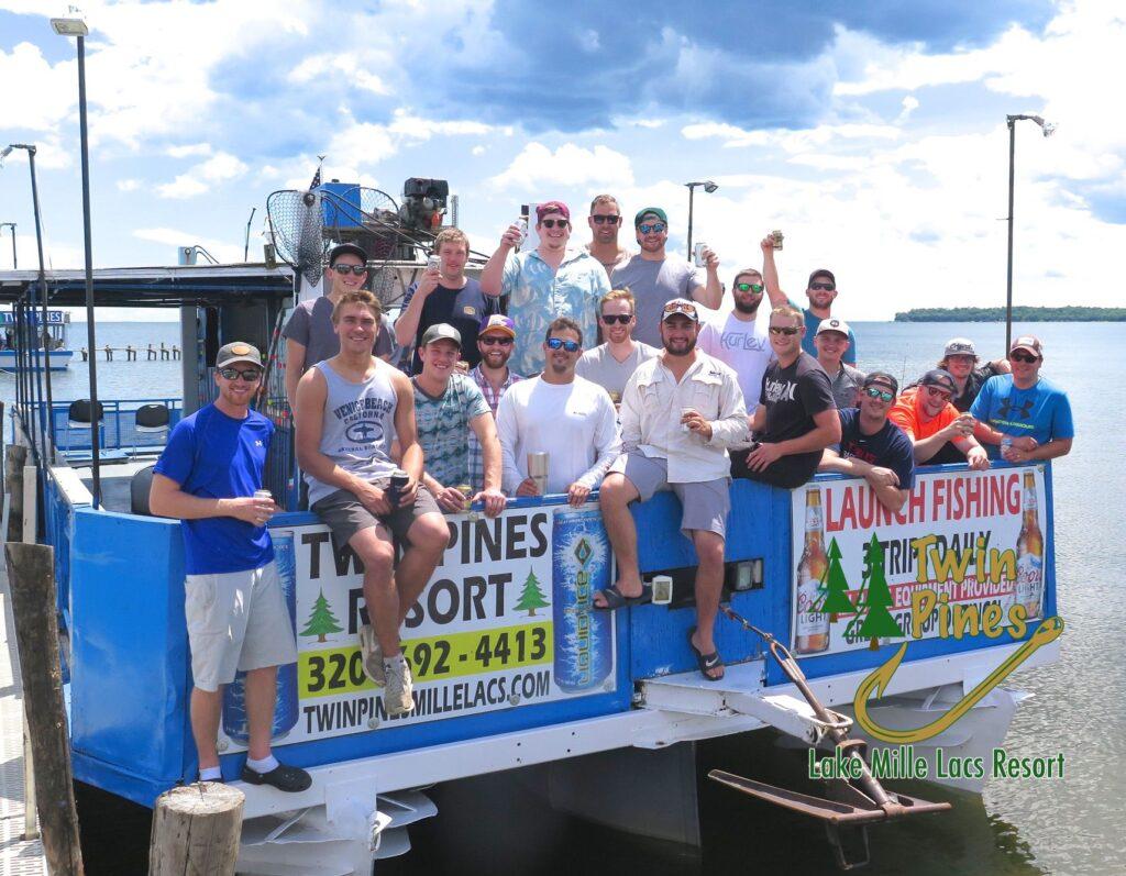 bachelor party posing on launch boat charter in summer